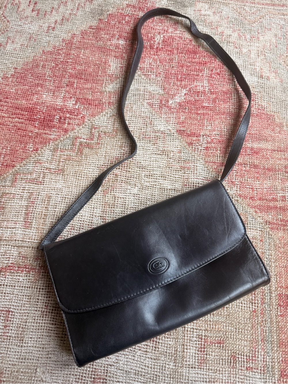 Classic Dark Brown Leather Shoulder Bag with Subtle Oval Logo